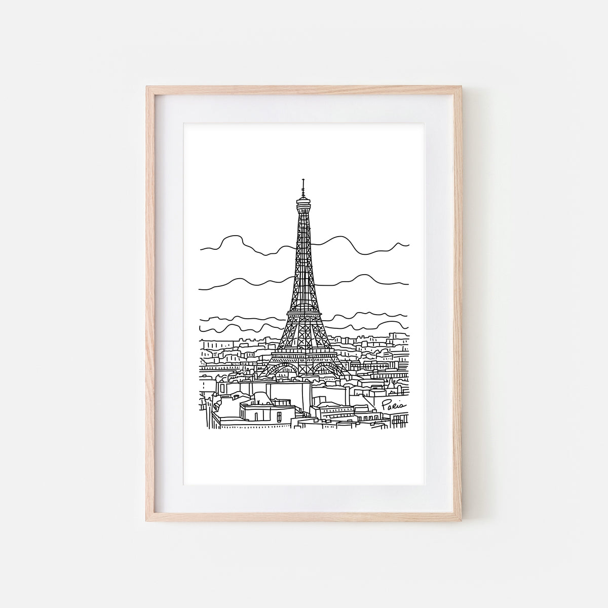 Nighttime Eiffel Tower picture with twinkling city lights and stars above.