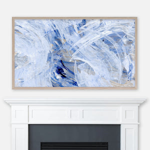 Indigo blue and white abstract painting displayed full screen in Samsung Frame TV above fireplace