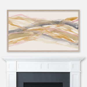 Abstract watercolor painting in tones of indigo gray, blush pink, gold and beige displayed in Samsung Frame TV above fireplace