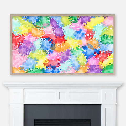Colorful abstract watercolor painting displayed full screen in Samsung Frame TV above fireplace