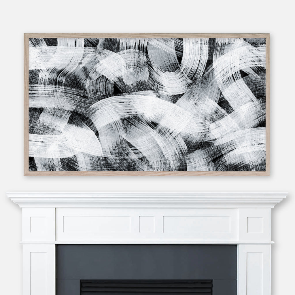 Black and white abstract brush stroke pattern painting displayed in Samsung Frame TV above fireplace