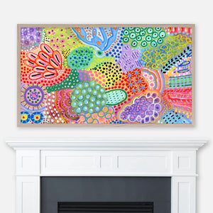 Colorful abstract painting displayed full screen in Samsung Frame TV above fireplace