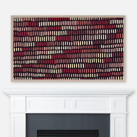 Abstract line pattern painting in shades of red and pink on black displayed full screen in Samsung Frame TV above fireplace