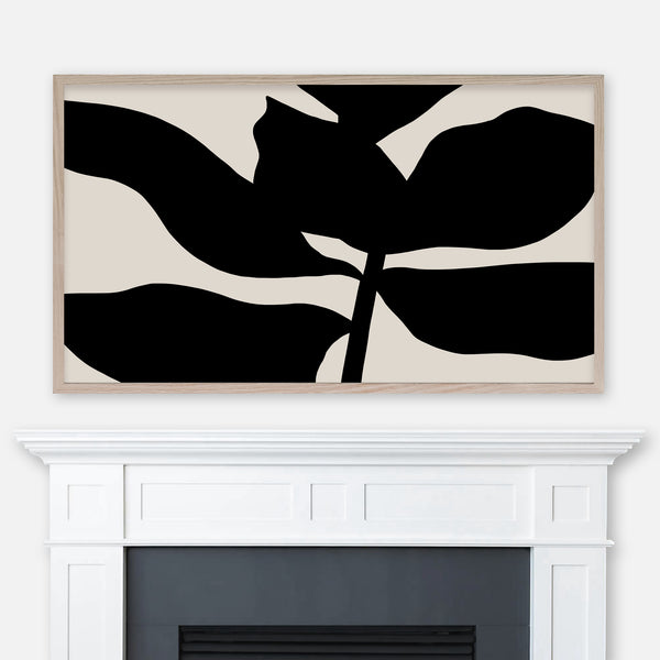 Artwork of a large black leafy plant silhouette on beige backgroud displayed full screen in Samsung Frame TV above fireplace
