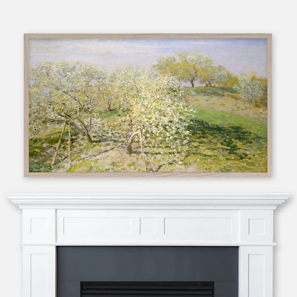 Painting Spring Fruit Trees in Bloom by Claude Monet displayed full screen in Samsung Frame TV above fireplace