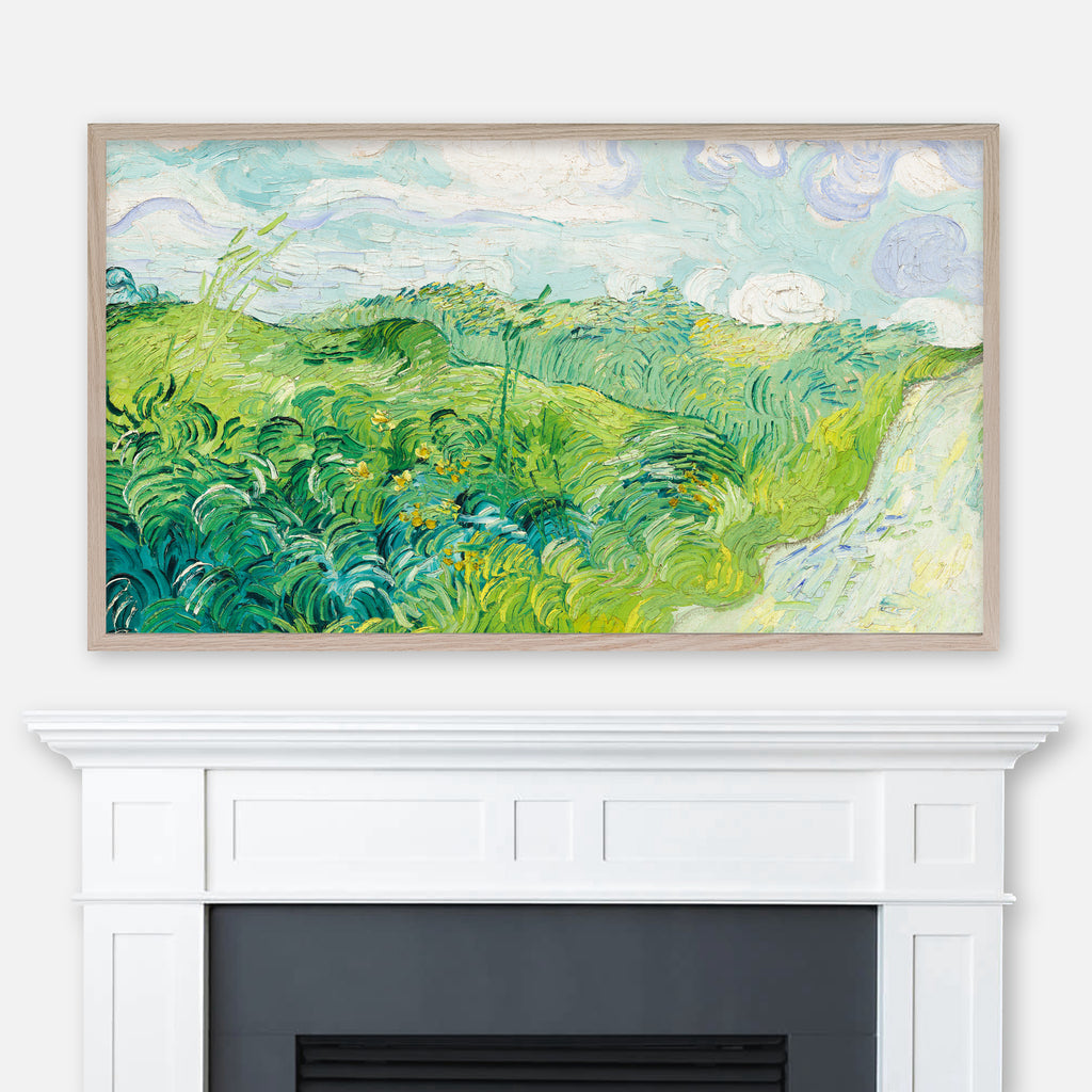 Painting Green Wheat Fields by Vincent Van Gogh displayed full screen in Samsung Frame TV above fireplace
