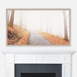 Watercolor autumn landscape painting of a foggy forest path displayed in Samsung Frame TV above fireplace