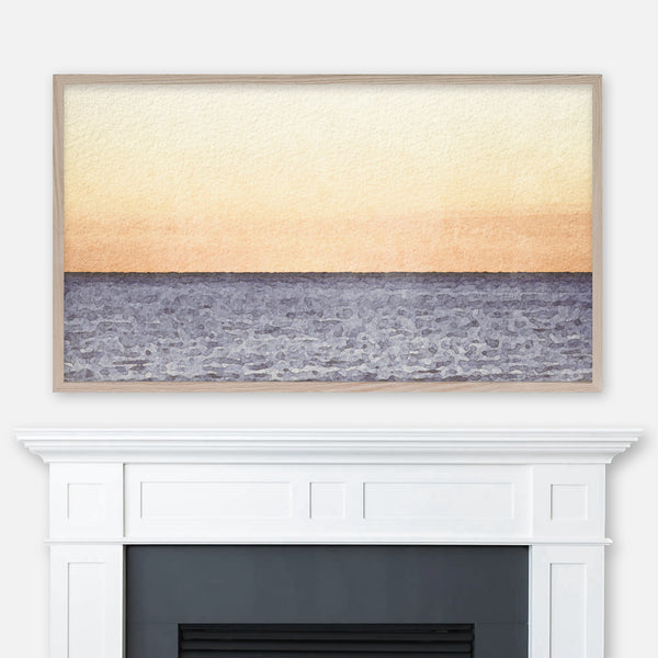 Watercolor landscape painting of an orange beach sunset displayed in Samsung Frame TV above fireplace