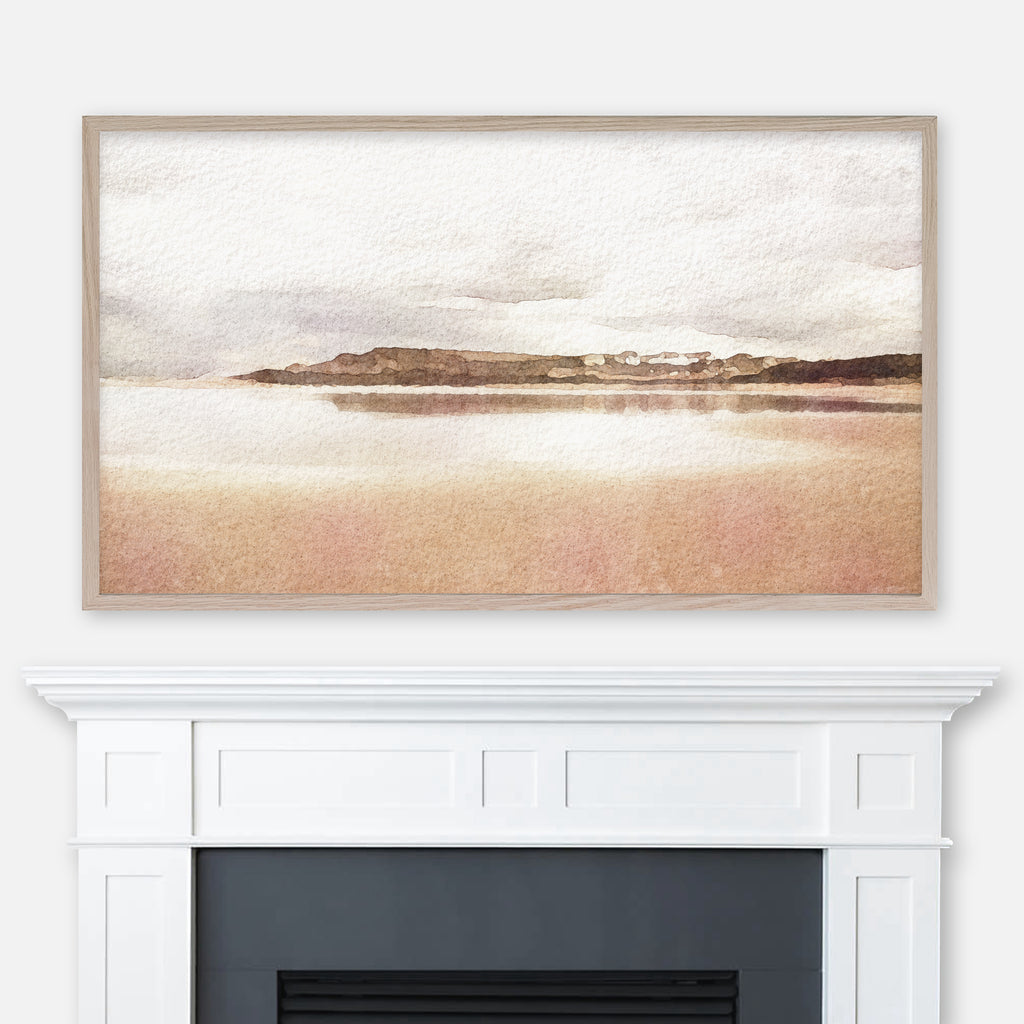 Cloudy coastline watercolor landscape painting in neutral earth tones displayed in Samsung Frame TV above fireplace