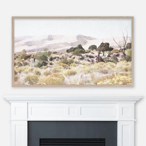 Desert landscape watercolor painting of Great Sand Dunes National Park Colorado displayed in Samsung Frame TV above fireplace