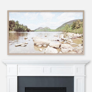 Acadia National Park lakeshore and mountains watercolor painting displayed full screen in Samsung Frame TV above fireplace