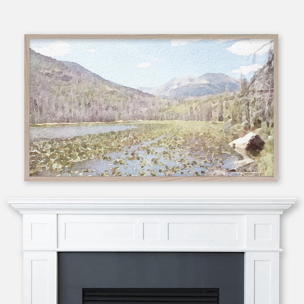 Watercolor landscape painting of Cub Lake in Colorado Rocky Mountain National Park displayed in Samsung Frame TV above fireplace