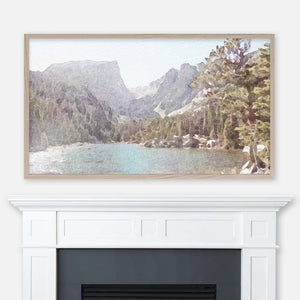 Watercolor landscape painting of Dream Lake in Rocky Mountains Colorado displayed in Samsung Frame TV above fireplace
