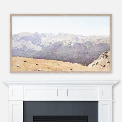 Rocky Mountain National Park Colorado watercolor painting displayed full screen in Samsung Frame TV above fireplace