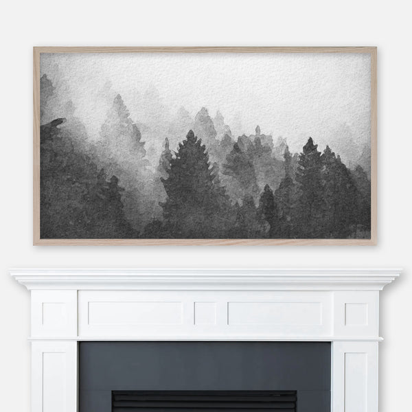 Black and white watercolor landscape painting of a foggy pine tree forest displayed in Samsung Frame TV above fireplace