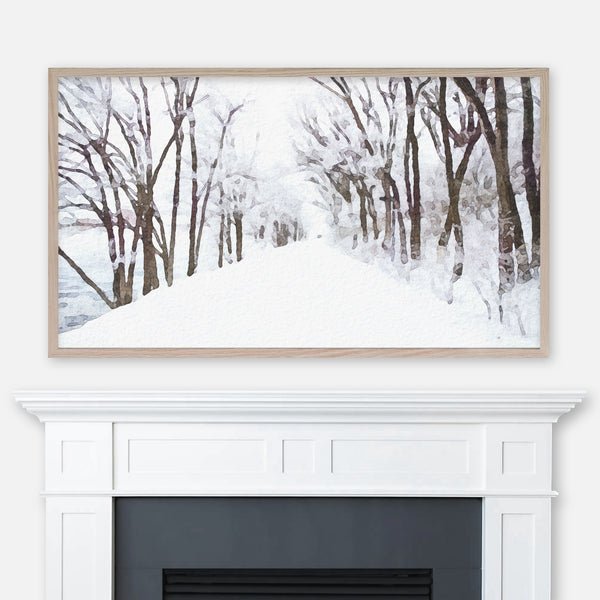 Watercolor winter landscape painting of a snow-covered tree road by a river displayed in Samsung Frame TV above fireplace