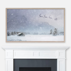 Christmas Samsung Frame TV Art 4K - Santa’s Sleigh in the Sky Over Illuminated Wooden Cabin & Mountains on a Snowy Night - Digital Download